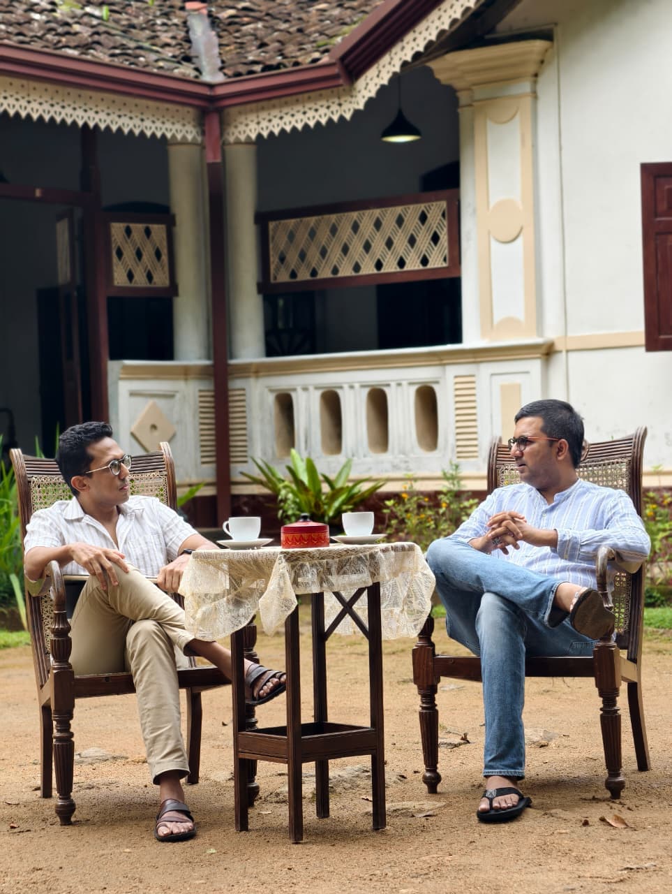 Courtyard conversation over tea, trust, pause, human scale
