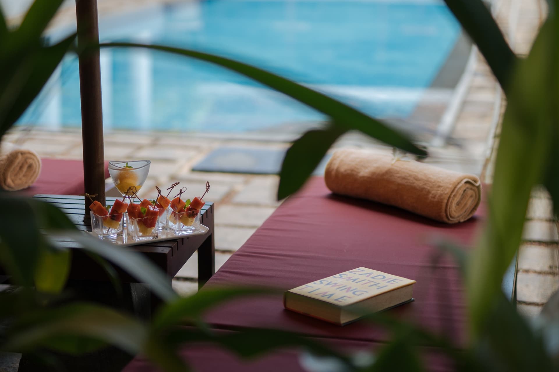 Loungers at the water’s edge, fruit, flower, unhurried hospitality